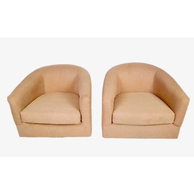 1980's lounge chairs with rose-colored tweed fabric. The chairs were crafted by Cachet Furniture in the 1980s and...