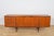 This mid-century sideboard in teak was produced in Great Britain, designed Tom Robertson to Mcintosh in the 1960s. The...