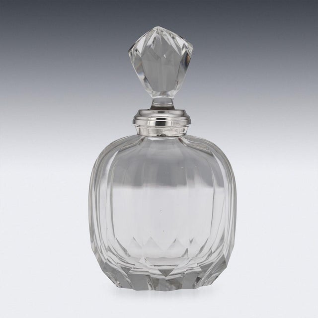 Antique 20th Century German solid silver and cut glass decanter. The piece features a substantial rippled cut glass body,...
