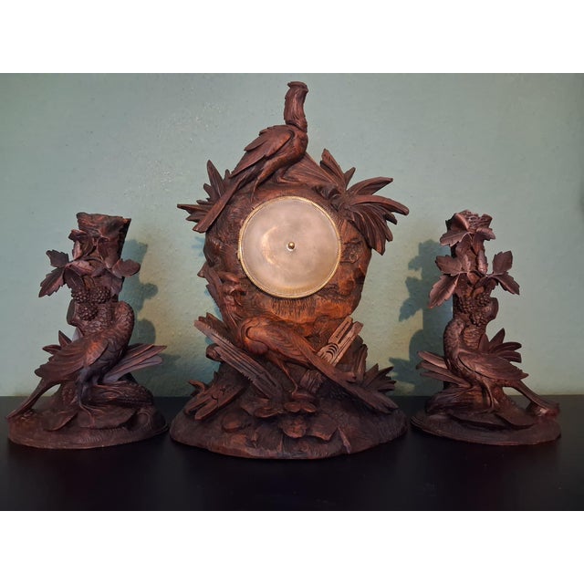 This set of three(3) pieces is made on Brienz ,Switzerland. Two vase holder with pheasants, walnut wood, floreal design...