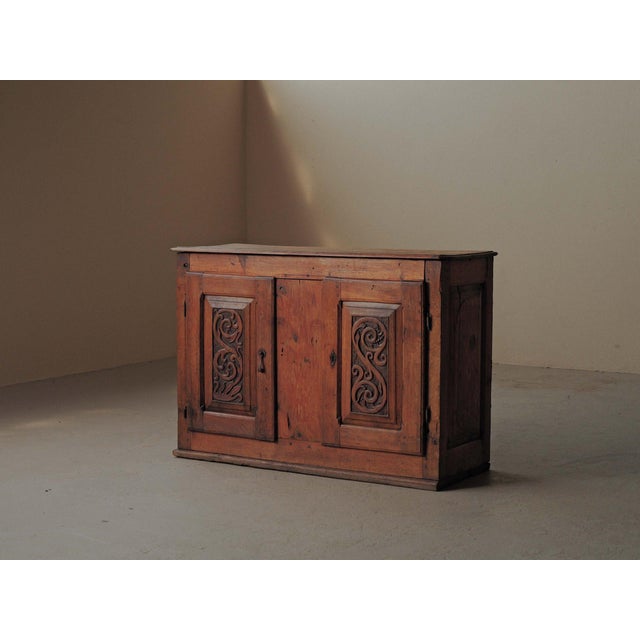 Mountain sideboard, crafted from solid larch and pine in the 19th century, It is a fine example of Alpine folk furniture...