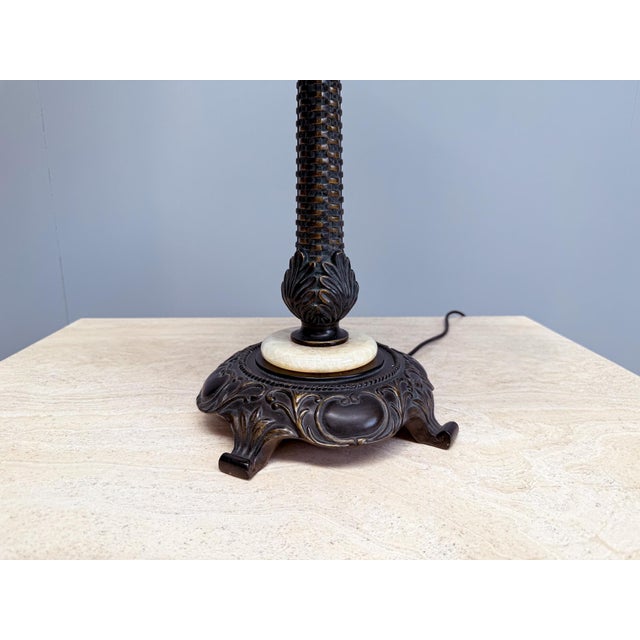 This stunning vintage Tiffany-style table lamp is a true eye-catcher with its large stained glass shade and ornate Art...