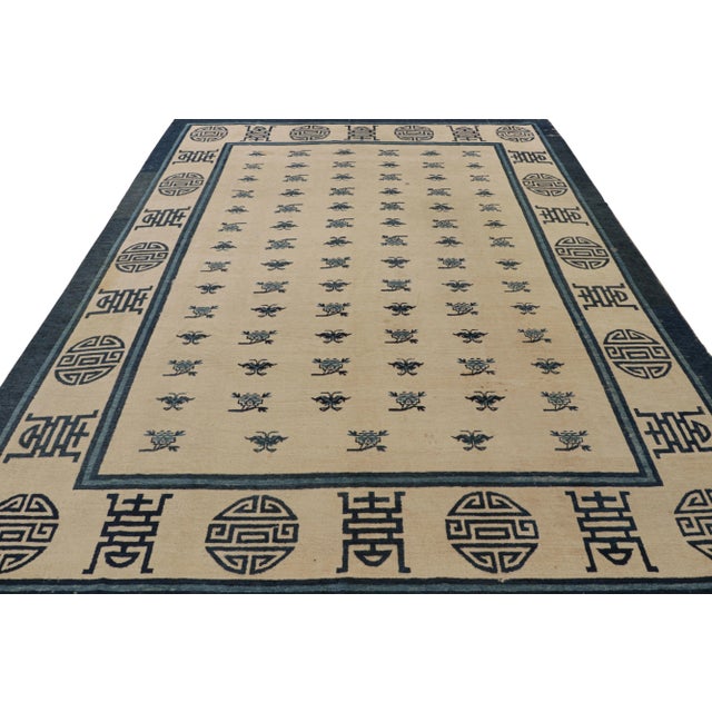 Hand-knotted wool and hailing from 1920s China, this 9x11 antique Chinese Art Deco rug is a one-of-a-kind new curation...