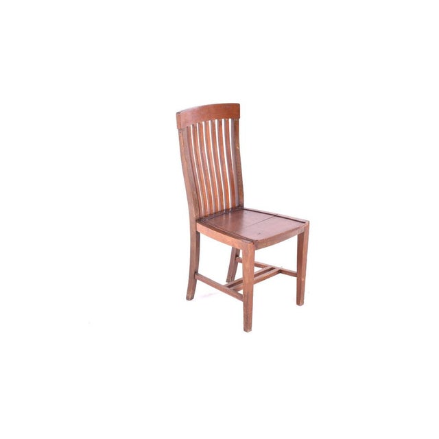 A magnificent set of six Olaio dining chairs in solid wood, with a robust structure and slatted backs and four legs. with...