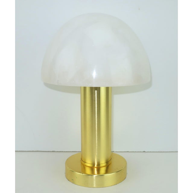 Currey & Company 'La Gravite' mini table lamp with an Art Deco style aesthetic. The brushed stainless steel base has a...