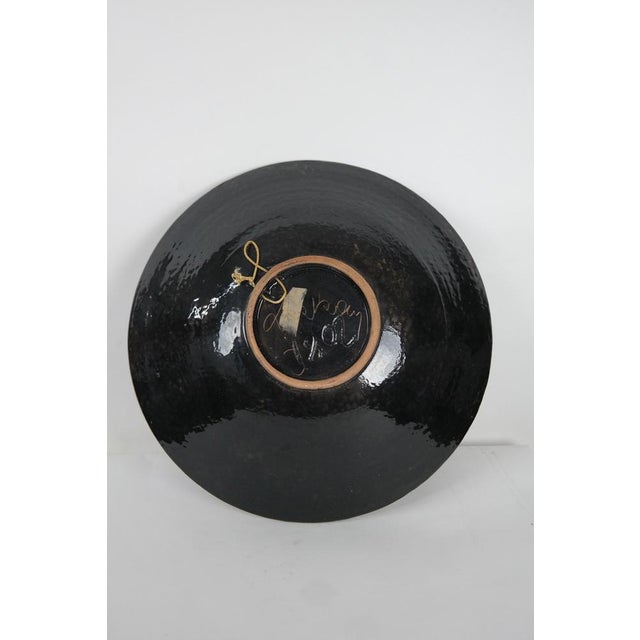 Vintage, bohemian ceramic wall plate from the 1970s.