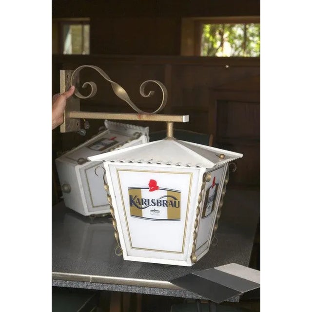 Pair of metal advertising wall lanterns from Alsace. Change the panels with plain glass for simple lanterns.