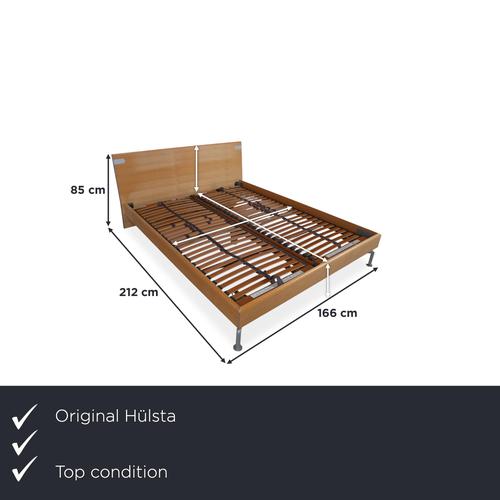 The Hülsta wooden bed is a truly striking centerpiece for your bedroom, perfectly embodying the typical quality and down-...