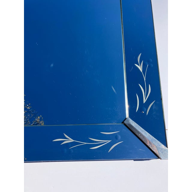 This 50’s mirror has etched corner panels. There is a mirror frame with etched corners applied over the main mirror The...