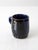 This vintage studio pottery mug exudes personality and style. Signed by the artist, the handmade piece showcases a rich...