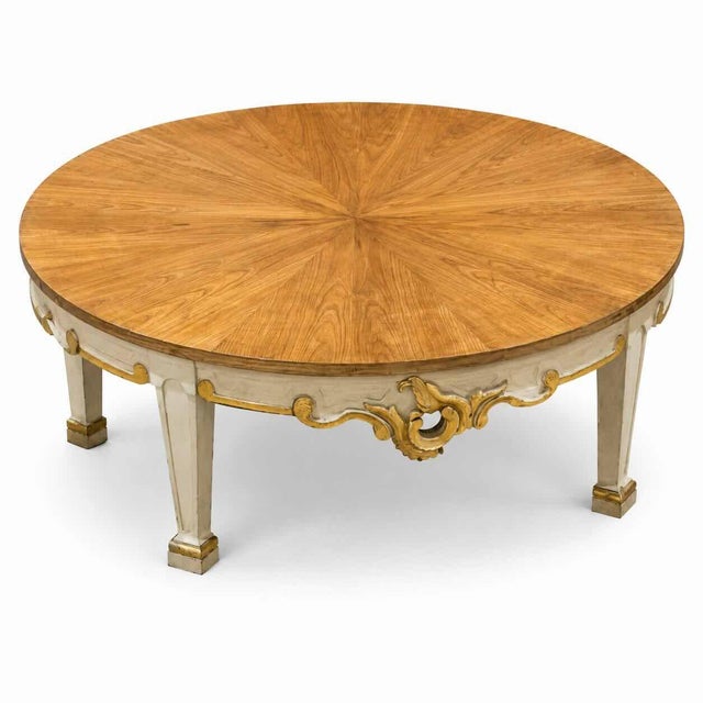 Elegant French Provincial round coffee table featuring a beautifully figured oak veneer top with a radiating sunburst...