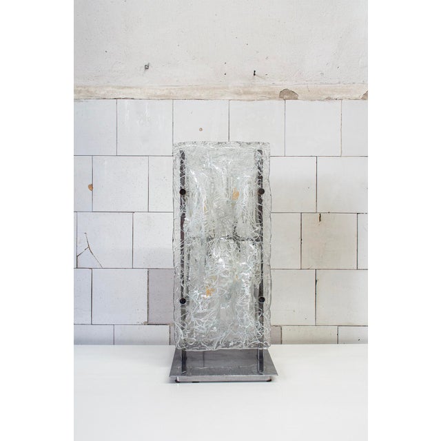 Sculptural table lamp with metal frame and Murano glass shades with etched filaments. Designer Toni Zuccheri Manufacturer...