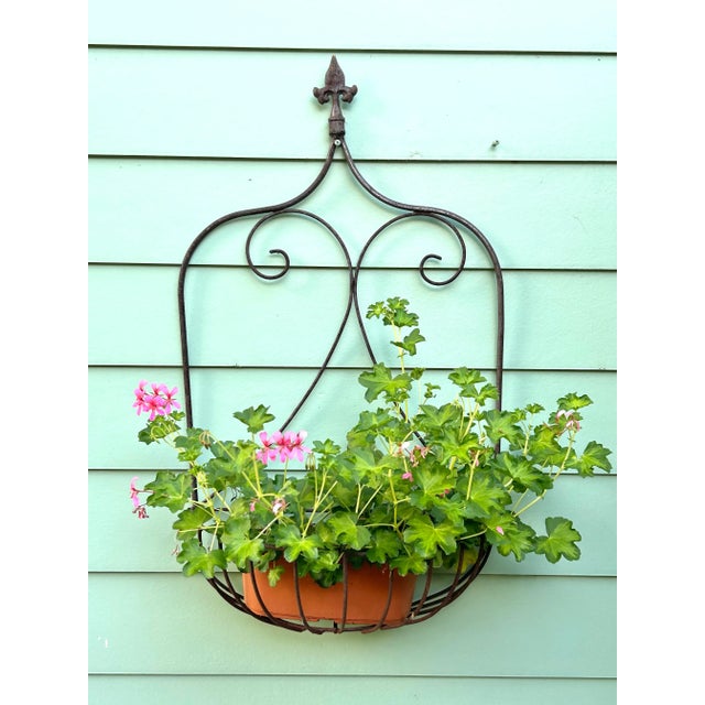 This is a beautiful antique planter. It has the capacity to hold a larger plant or flowers. It can also accommodate a pot...