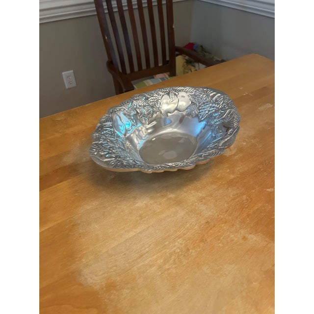 Decorative pewter serving dish with richly embossed fruit and foliage motifs. Crafted in a substantial case metal with an...