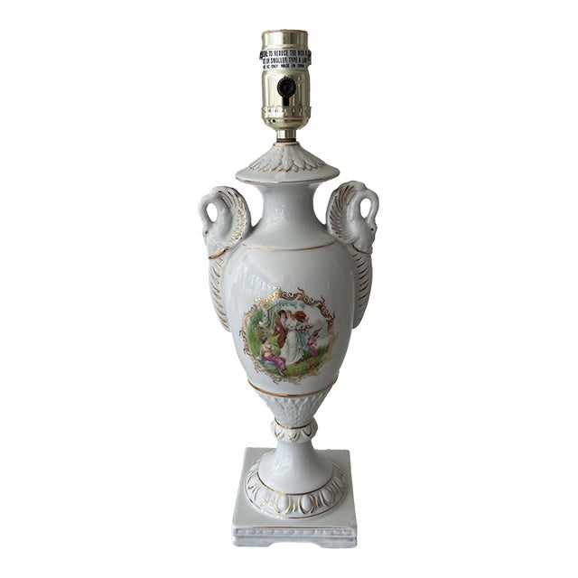 Capture French romance with this vintage lamp. Bright white ceramic lamp with gold detailing. Double arms and scalloping...