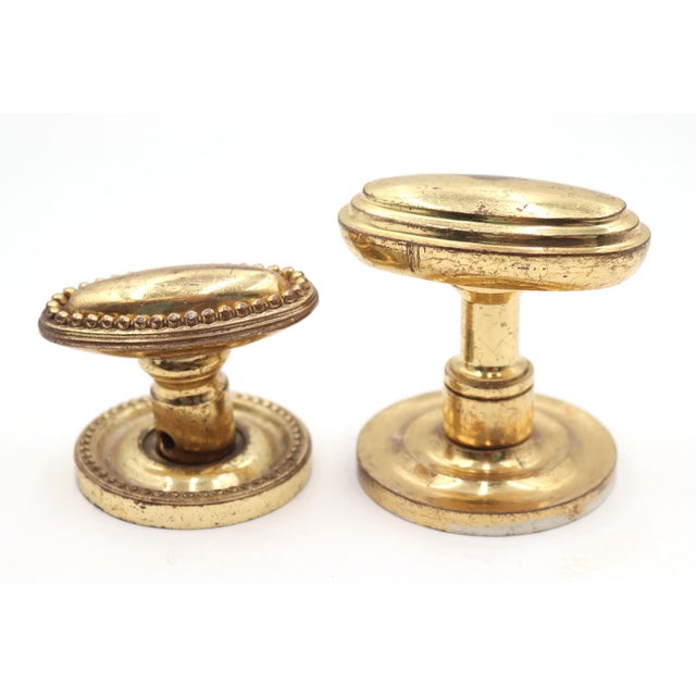 Modern style oval entry door knobs made of brass with a polished finish. Priced as two door knobs, two rosettes, and a...