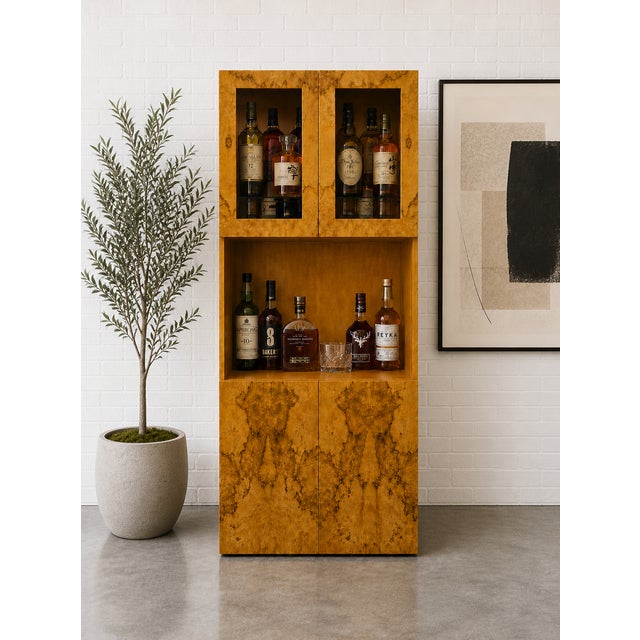 Vintage Mid Century Modern burlwood bar cabinet featuring striking, symmetrical grain and a warm honey tone. This piece...