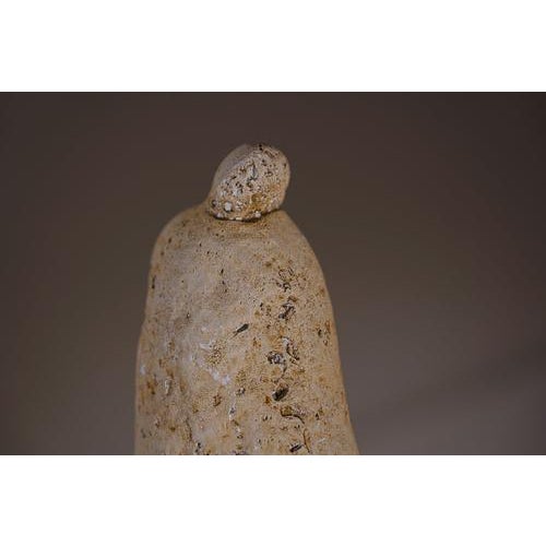 Watchman (1959) by Juan Asensio, made of carved stone. The piece presents a compact volume of clean lines that define an...