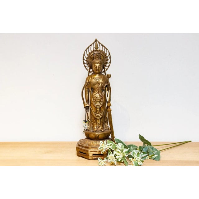 A majestic vintage Japanese brass Buddha, a timeless embodiment of peace and wisdom. Handcrafted with devotion, this...