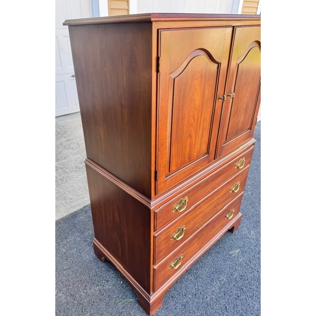 Beautiful gentlemans tall chest or armoire by Henkel Harris. Chest is made of solid black cherry with brass hardware. Love...