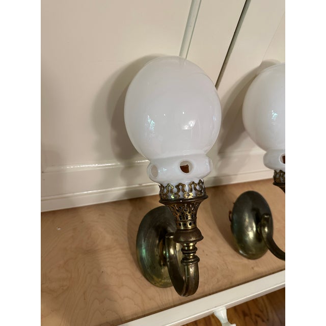 Old Lights On is pleased to offer this signed pair of vintage brass wall sconces with vintage glass shades. They are wired...