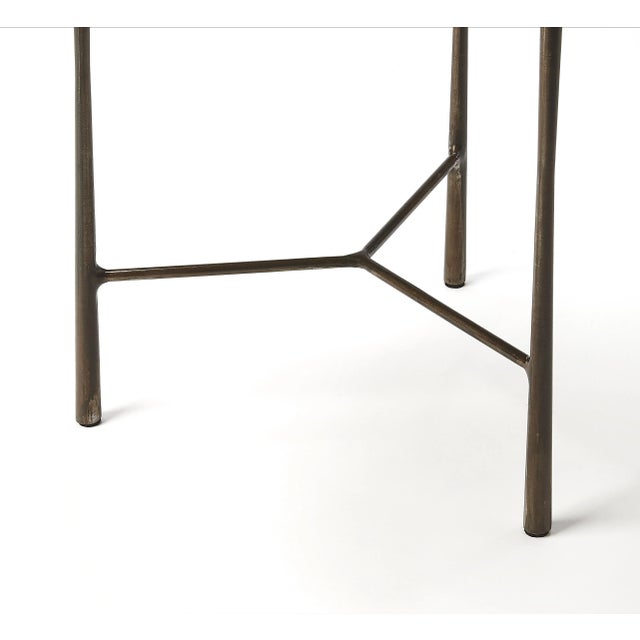 This round live edge end table makes a great addition in a living room or office. Its forged iron base supports a solid...