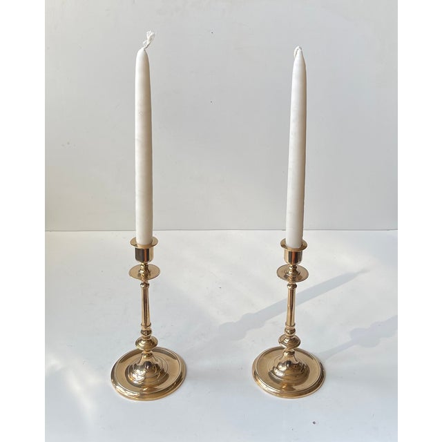 A pair of gustavian style swedish candlesticks in brass. Classic features and architectural styling. Design by carl w....