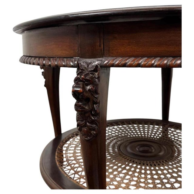 A striking and beautifully crafted 20th-century mahogany coffee table in the Chippendale style, combining elaborate...