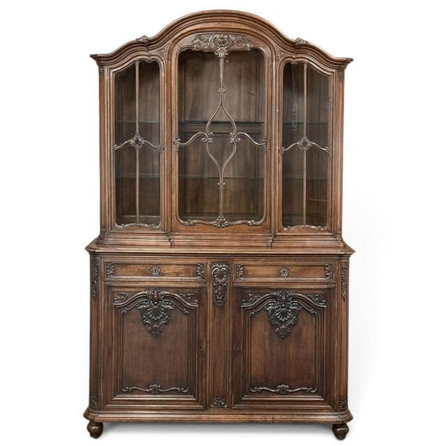 Richly carved walnut and beautifully balanced proportions distinguish this French Liégeois china buffet, designed to unite...