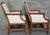 A handsome pair of Stickley armchairs crafted in quarter-sawn oak with clean architectural lines inspired by the American...