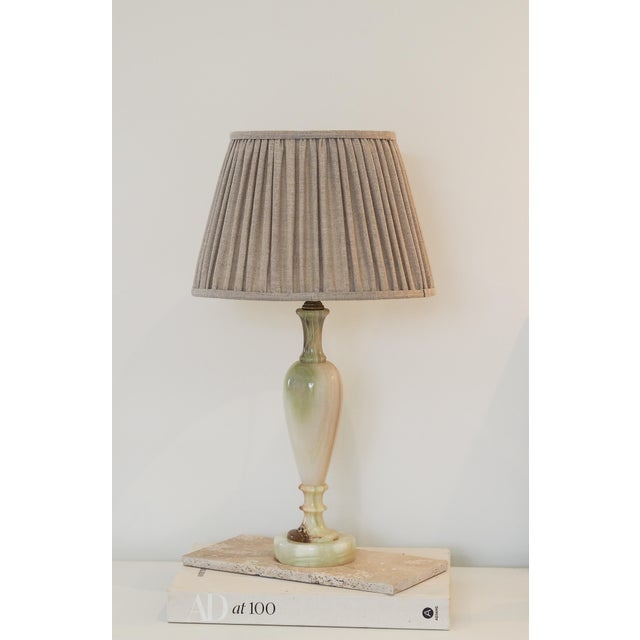 A beautifully detailed solid Onyx Mid-Century Lamp. with antique brass lamp holder. This lamp is sold as seen and may show...