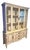 A striking, exceptionally well-crafted mid-century modern French Provincial style one-piece china cabinet and display...