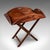 This is an antique butler's tray table. An English, mahogany and brass drop-flap serving stand, dating to the Edwardian...