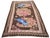 Hand-knotted with care using traditional rug making techniques, this wool rug blends timeless craftsmanship with a modern...