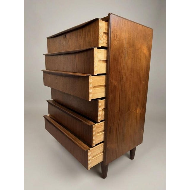 Enhance your home with this 1960s Danish tallboy, a functional piece of furniture that demonstrates excellent...