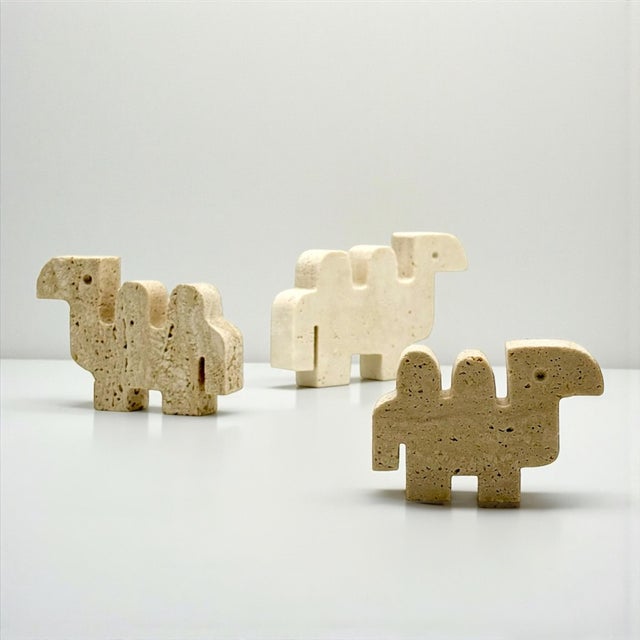 This set of three travertine camel sculptures was handcrafted in Italy during the 1960s and 1970s. Carved from natural...