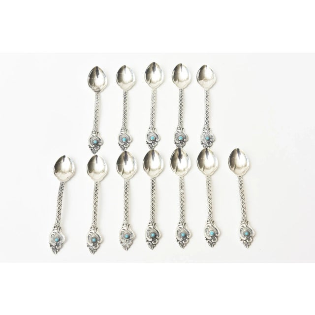 These lovely and regal set of 14 sterling silver and real turquoise demitasse, expresso or serving spoons are vintage....