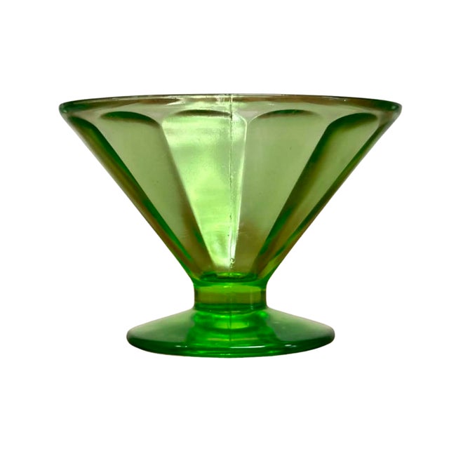 A striking set of four vintage Art Deco sorbet cups crafted in luminous uranium green pressed glass. Each cup features a...