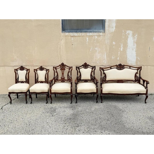 Antique Victorian Carved Mahogany Inlaid Parlor Sofa Set - 5 Pcs. Set includes (1) Loveseat sofa. (2) Armchairs, (2) Side...