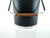 A 1960s ice bucket attributed to Kromex, combining black faux-alligator embossed vinyl with polished chrome and warm wood...