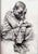 Child by Chris Hopkins | Charcoal on paper of a seated boy with a pensive expression For Sale