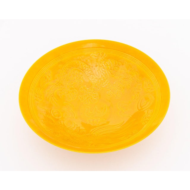 Chinese Incised Dragon and Phoenix Motif Yellow Glazed Porcelain Flaring Bowl, blue underglaze eight character mark to...