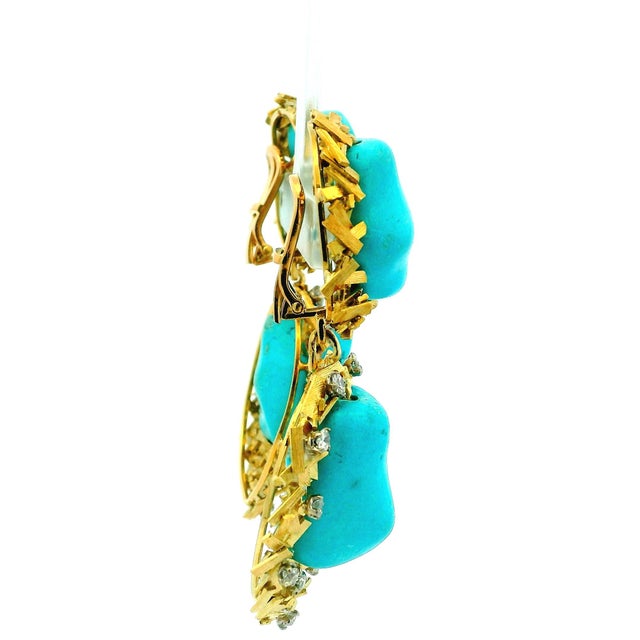 A striking pair of vintage Italian turquoise and diamond drop earrings crafted in richly textured 14 karat yellow gold,...