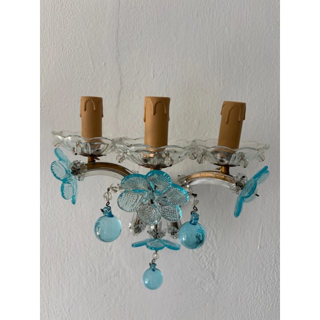 One of a kind set! Italian sconces housing three lights each, sitting in crystal bobeches with crystal balls encircling....