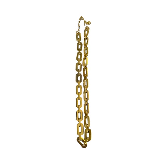 This elegant Vintage Signed TRIFARI Gold Tone Necklace features a rectangular link chain design and includes extension to...