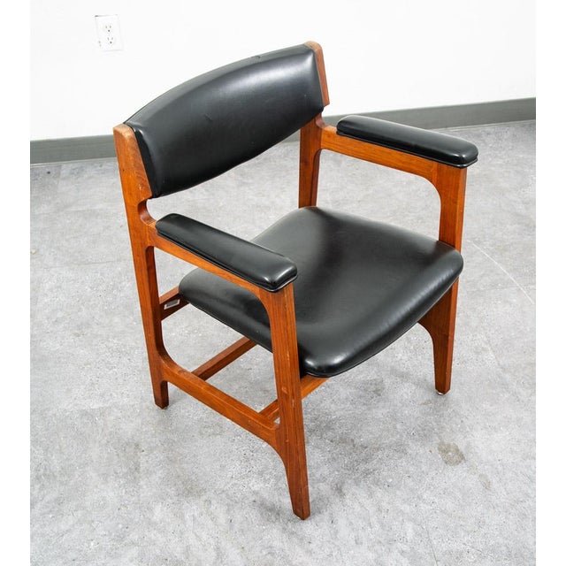 Unique American made executive office / armchair attributed to Gunlocke. Clean look with the classic solid walnut arms and...