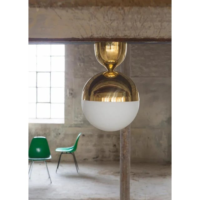 Nickel ceiling lamp by magic circus editions. Dimensions: d 25 x w 25 x h 37.5 cm. Materials: brass, mouth blown glass...