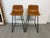 Design Plus Gallery presents a Pair of Faux Leather Bar Stools. The stools offer great tones for a warm and inviting...