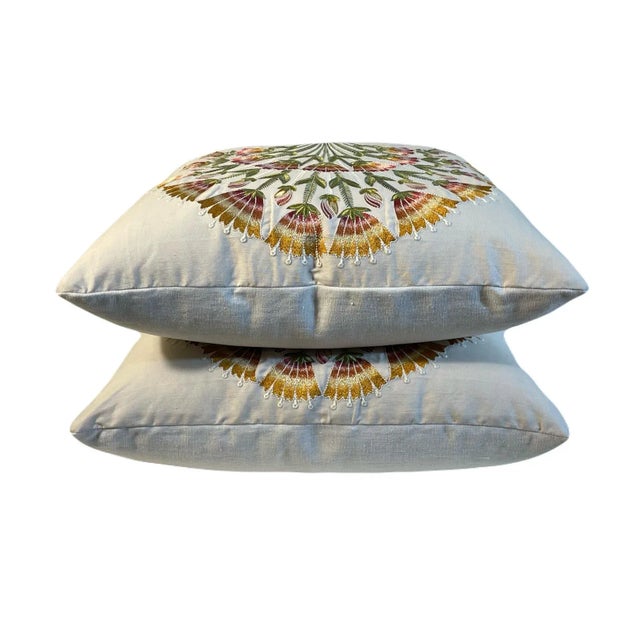 This pair of pillows features Sanderson Wild Tulip Amber “Cream” fabric on the front with Jacques Bouvet/Albi Champagne...