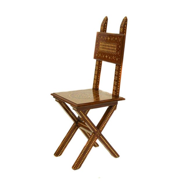 This antique Italian side chair is a refined example of decorative craftsmanship, distinguished by its intricate inlaid...